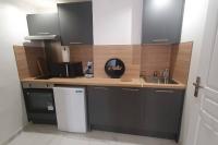 a kitchen with a sink and a counter top at Studio palais de justice in Rouen