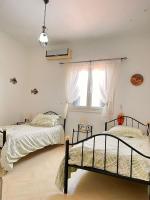 Postel nebo postele na pokoji v ubytování Villa Elena