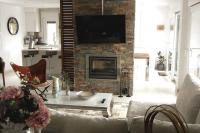 Televízia a/alebo spoločenská miestnosť v ubytovaní Chalet de diseño moderno en Sanxenxo