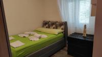 Posteľ alebo postele v izbe v ubytovaní Apartment KRISTINA