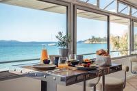 a breakfast table with a view of the ocean at Surplage Hotel Cavalière in Le Lavandou