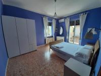 Posteľ alebo postele v izbe v ubytovaní Casa vacanze Omero 2