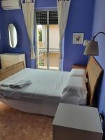 Posteľ alebo postele v izbe v ubytovaní Casa vacanze Omero 2