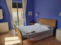 Posteľ alebo postele v izbe v ubytovaní Casa vacanze Omero 2
