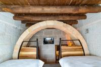 Postel nebo postele na pokoji v ubytování Cappadocia Snora Cave