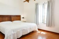 A bed or beds in a room at Agroturismo Son Triay