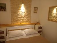 Postel nebo postele na pokoji v ubytování Apartments Janjac