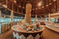 a restaurant with a table with food on it at The Haven Khao Lak in Khao Lak