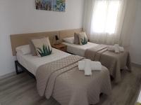 Posteľ alebo postele v izbe v ubytovaní Apartamento Maya Relax Salou