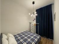 Postel nebo postele na pokoji v ubytování Andrews Cosy Apartment