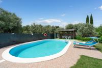 Bazén v ubytovaní Villa Le Vigne alebo v jeho blízkosti
