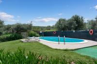 Bazén v ubytovaní Villa Le Vigne alebo v jeho blízkosti