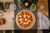 a pizza sitting on top of a table at loisi's Boutiquehotel in Achenkirch