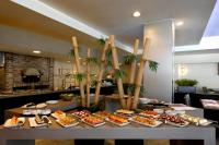 a buffet with many different types of food on a table at Novotel Monterrey Valle in Monterrey