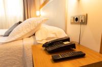 Postel nebo postele na pokoji v ubytování Hotel Montedobra