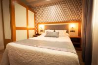 Postel nebo postele na pokoji v ubytování Hotel Montedobra