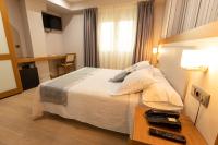 Postel nebo postele na pokoji v ubytování Hotel Montedobra