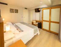 Postel nebo postele na pokoji v ubytování Hotel Montedobra