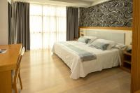 Postel nebo postele na pokoji v ubytování Hotel Montedobra
