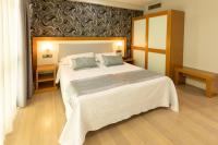 Postel nebo postele na pokoji v ubytování Hotel Montedobra