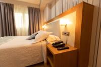 Postel nebo postele na pokoji v ubytování Hotel Montedobra