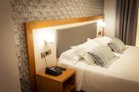 Postel nebo postele na pokoji v ubytování Hotel Montedobra