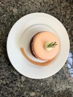a white plate with a dessert on a table at chambre d'hôtes Le Domaine de la Vallée in Saint-Martin-de-Varreville