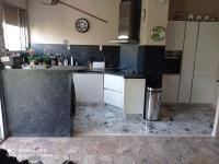 a kitchen with white cabinets and a counter top at Nice Fabron 90 m2 avec Garage in Nice