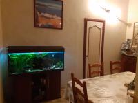 a living room with a fish tank on a tv at Nice Fabron 90 m2 avec Garage in Nice