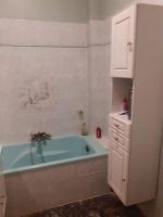 a bathroom with a tub and a white cabinet at Nice Fabron 90 m2 avec Garage in Nice