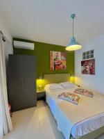 A bed or beds in a room at Koumaros Aparthotel