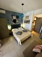 A bed or beds in a room at Koumaros Aparthotel