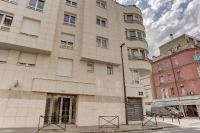 a large white building on a city street at Le Charlemagne- Boulogne in Boulogne-Billancourt