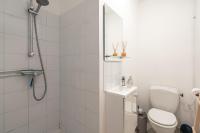 a bathroom with a shower and a toilet and a sink at Casa Lyon Cosy 1 Br Flat Part Dieu in Lyon