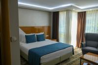 Postel nebo postele na pokoji v ubytování Bulvar Hotel