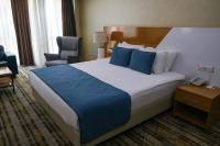 Postel nebo postele na pokoji v ubytování Bulvar Hotel