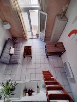 an overhead view of a room with a staircase and a table at Appartement entier - Le repos des danseurs in Montpellier