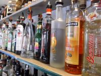 a shelf filled with lots of bottles of alcohol at Sundeck Hotel in Perisher Valley