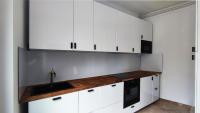 a kitchen with white cabinets and a sink at L&#39;Idrac, Appartements en Hyper centre in Toulouse