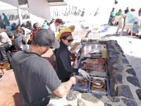 a group of people preparing food at a buffet at Sundeck Hotel in Perisher Valley