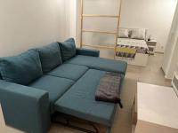 a living room with a blue couch and a chair at Charming intim apartment in Paris South in Montrouge