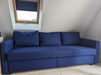 a blue couch in a room with a window at Appartement Châtelaillon-Plage, 2 pièces, 4 personnes - FR-1-706-2 in Châtelaillon-Plage