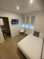 A bed or beds in a room at Habitaciones Arrisal