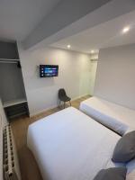 A bed or beds in a room at Habitaciones Arrisal
