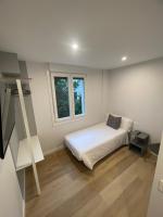 A bed or beds in a room at Habitaciones Arrisal