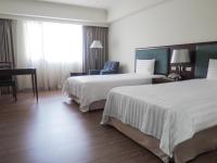 Una cama o camas en una habitaci&oacute;n de CHECK inn Taipei Neihu