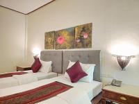 Postel nebo postele na pokoji v ubytování Baan Panwa Resort