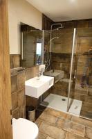 a bathroom with a sink and a shower at Camping Bissen in Esch-sur-Sûre