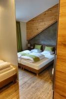 a bedroom with two beds in a room at Camping Bissen in Esch-sur-Sûre