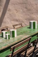 four coffee cups sitting on a green table at Maison Arthur in Aigues-Mortes